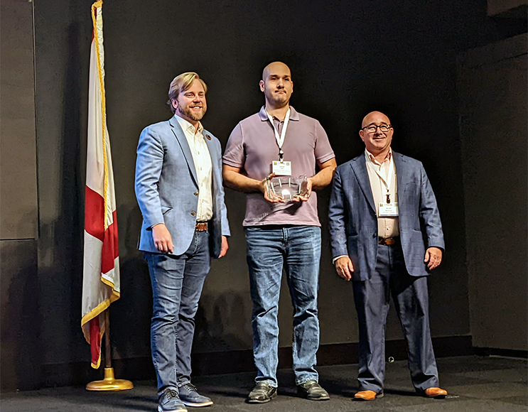 Jason Cox receiving award